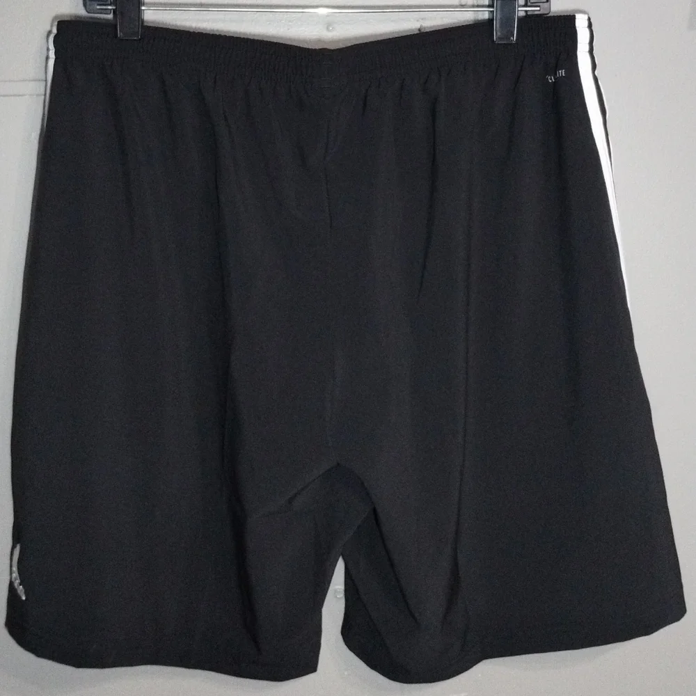 Adidas Black and White Athletic Shorts with Iconic Stripes